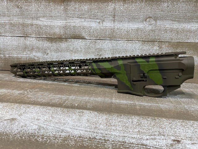 Cerakote spray application in progress at Younger Gunworks